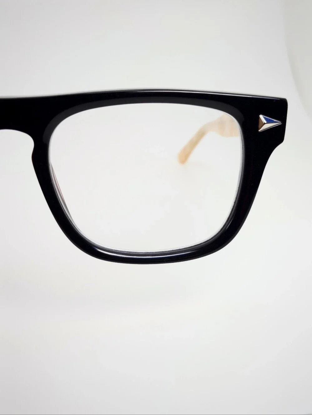 Fluoresce. Black Wayfarer-Style Eyeglasses with Pearl Temples.